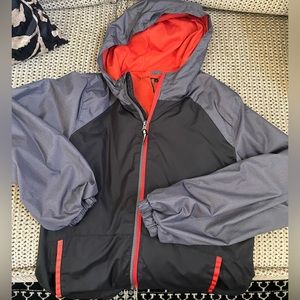 Boys Raincoat. Size M (10-12), dark gray with red, lighter gray. Great condition